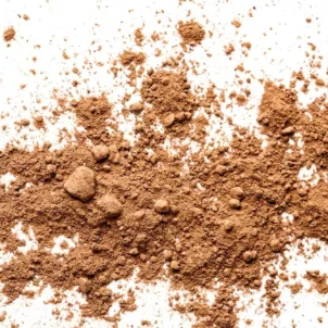 Brown powder splayed out on white background