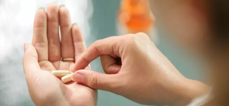 Woman holding the best probiotic capsule in her palm