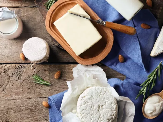 Overhead shot of dairy products that can lead to inflammation and acne