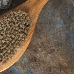 Overhead shot of dry brush that can help achieve glowing skin