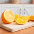 Sliced oranges and orange juice on the counter as an example of immunity boosting foods