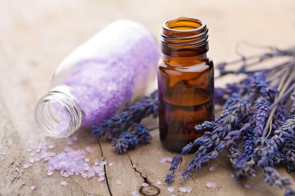 Lavender aromatherapy essential oils, bath salts and fresh lavender.