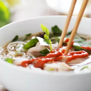 Delicious bowl of soup with chopsticks using a bone broth recipe