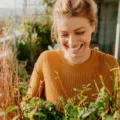 Calm woman gardening rhodiola rosea herb