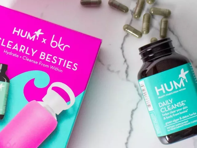 Box including HUM Daily Cleanse and pink bkr water bottle