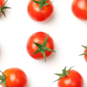 Bright, ripe tomatoes - which have lectic - on white background