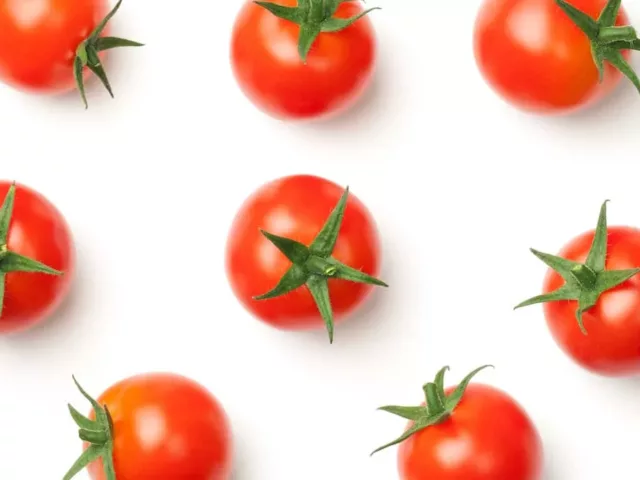 Bright, ripe tomatoes - which have lectic - on white background