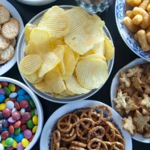 Table full of bowls of junk food, which have unhealthy food additives