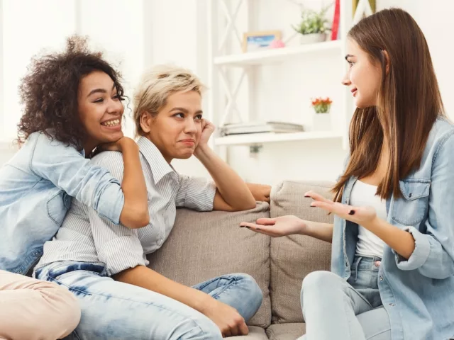 Group of female friends hanging out on couch