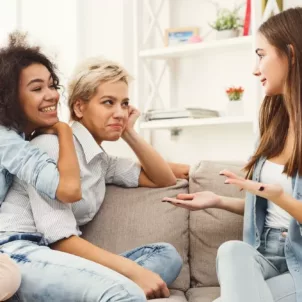 Group of female friends hanging out on couch