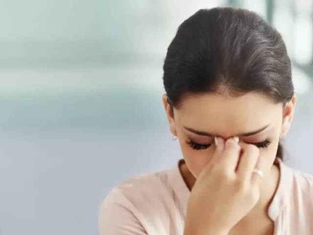 Woman applying pressure to strategic points to relieve her headache