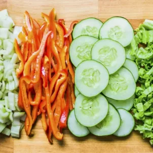 Fresh-cut veggies lined up for meal prep