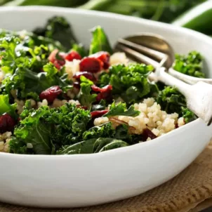 Anti-Inflammatory meal of kale and quinoa salad on nice tablescape