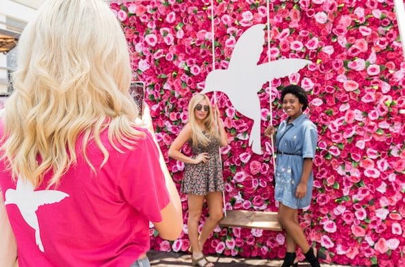 Girls taking photo at Rose Wall at HUM Together 2018