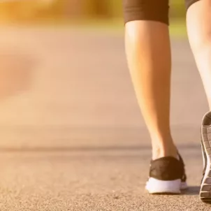 Close up of woman walking from behind