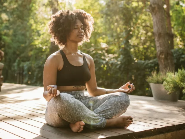 Woman meditating at home