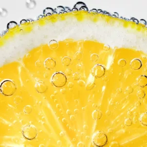 Lemon slice submerged in LaCroix sparkling water