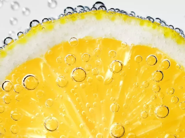 Lemon slice submerged in LaCroix sparkling water