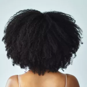 Back of woman's hair after natural hair DevaCut makeover