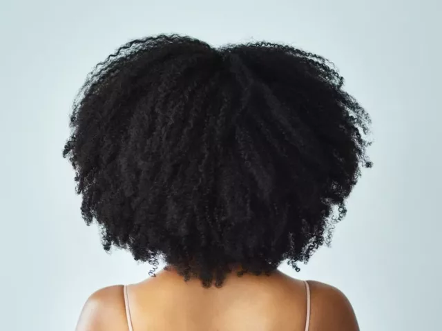 Back of woman's hair after natural hair DevaCut makeover