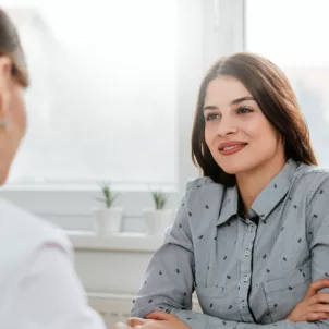 Woman speaking to her holistic gynecologist