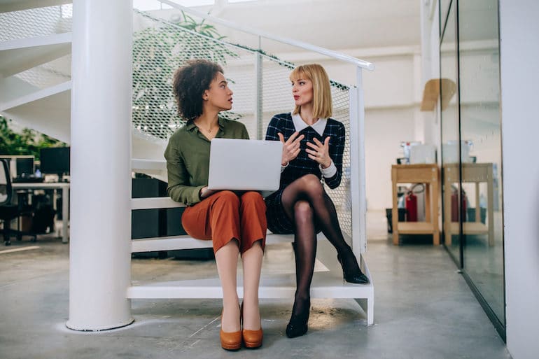 Women discussing how to deal with burnout at work