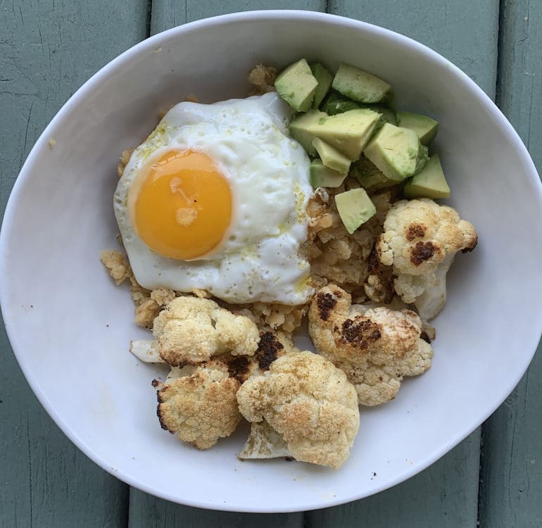 Poached egg, roasted cauliflower, and avocado breakfast