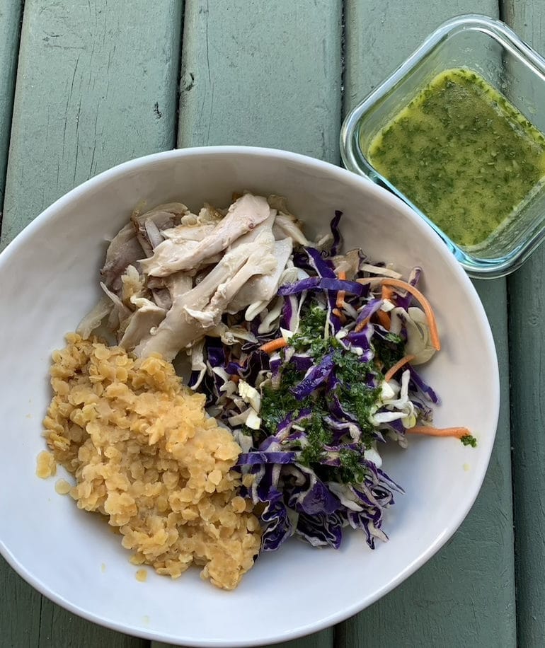 Rotisserie chicken, cole slaw with olive oil, lemon juice, cilantro, garlic and salt dressing, lentils