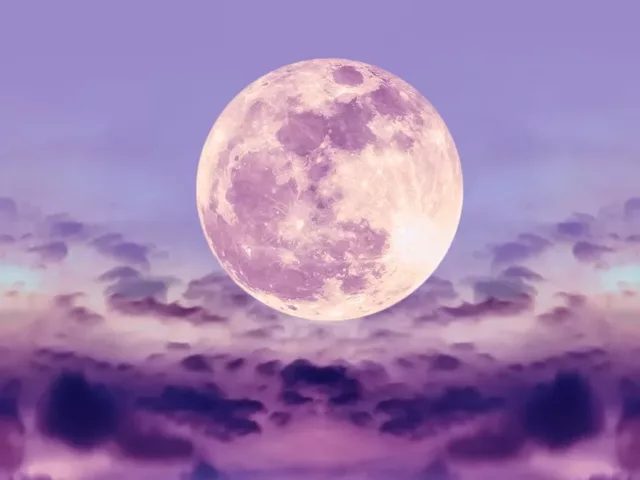 Full moon in purple and pink night sky