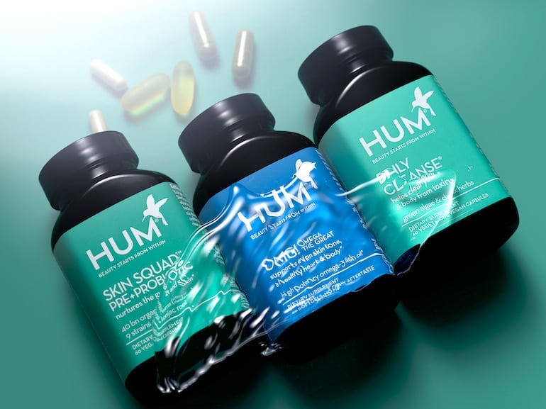 HUM supplements for clear skin - Skin Squad, OMG! Omega, and Daily Cleanse under water