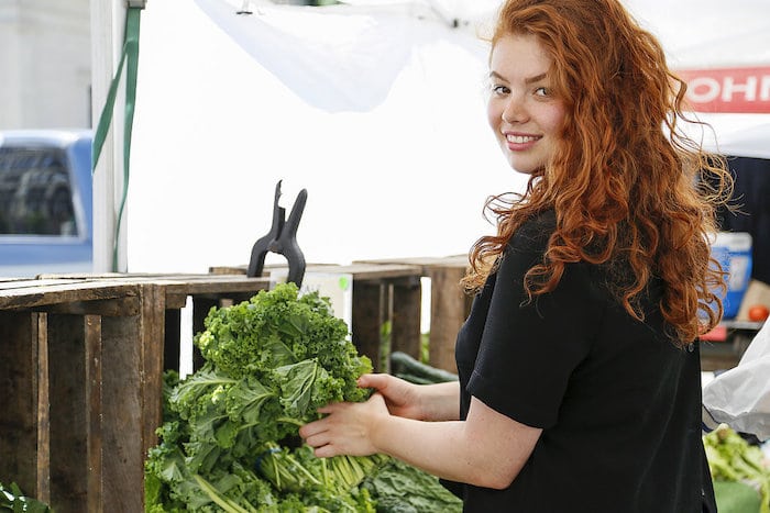 Health Chef Julia Chebotar shopping at a farmer's market