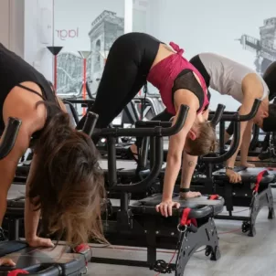 Women on Megaformer machines at Lagree NY