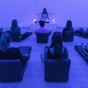 Meditation session with blue lighting at Unplug Meditation West Hollywood