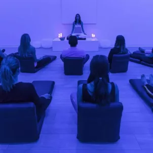 Meditation session with blue lighting at Unplug Meditation West Hollywood