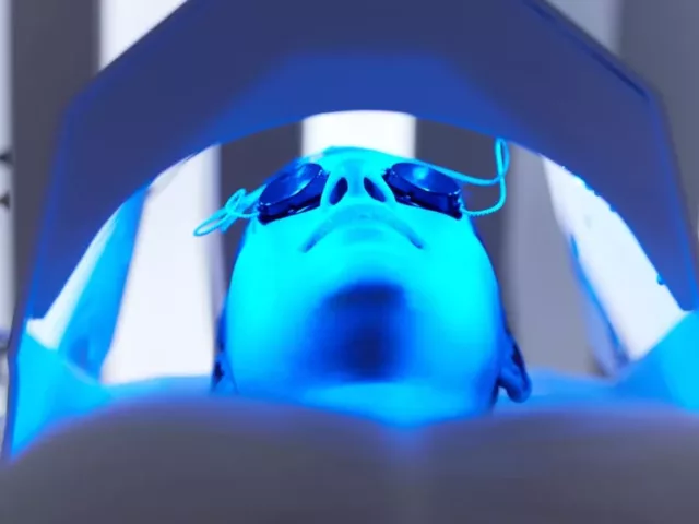 Woman getting LED blue light therapy for acne