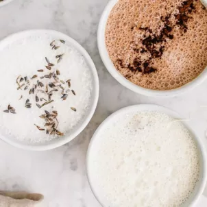 Lavender latte, camomile honey latte, and peppermint hot chocolate on marble table