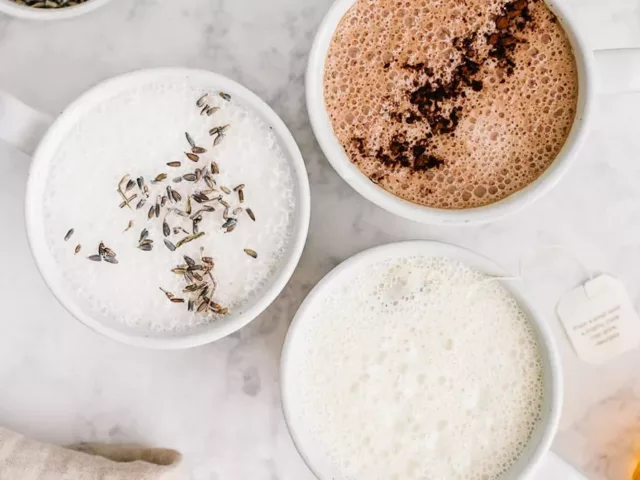 Lavender latte, camomile honey latte, and peppermint hot chocolate on marble table