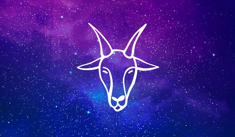 Capricorn goat symbol on purple and blue starry background