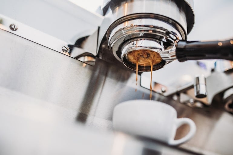 Making coffee drink in an espresso machine