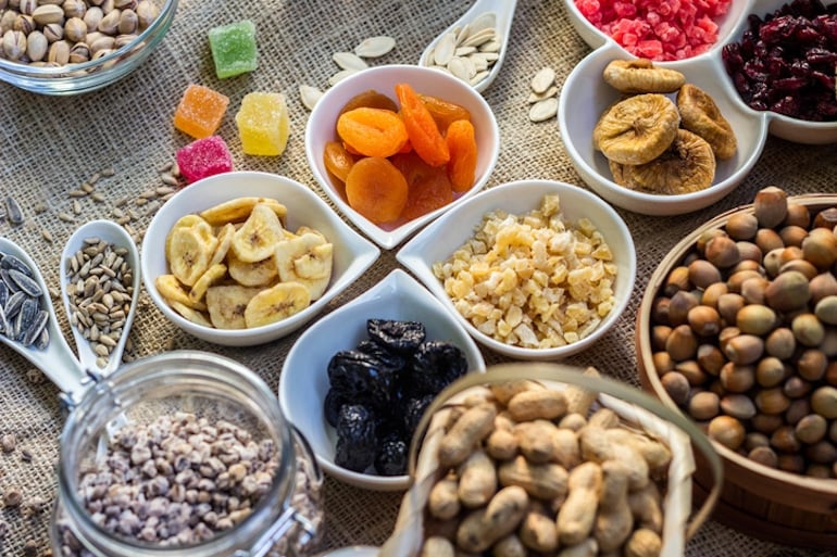 Assorted ramekins of colorful dried fruit and nuts