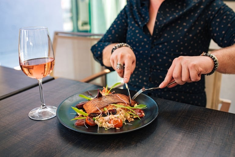 Man eating salmon, a D3 rich food