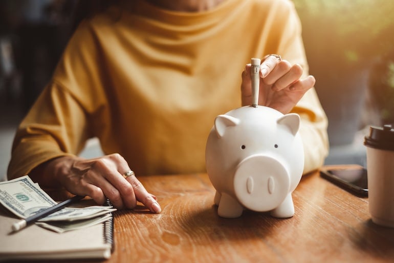 Woman saving money for new year's resolution