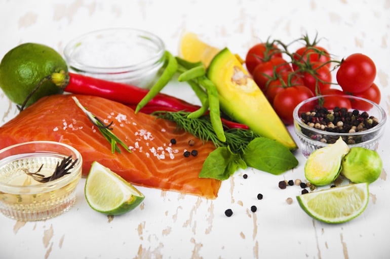 Anti-candida diet foods including salmon, avocado, extra virgin olive oil, and Brussels sprouts