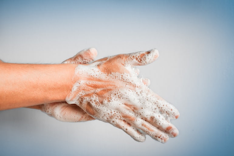 Person washing their hands with soap for immune protection