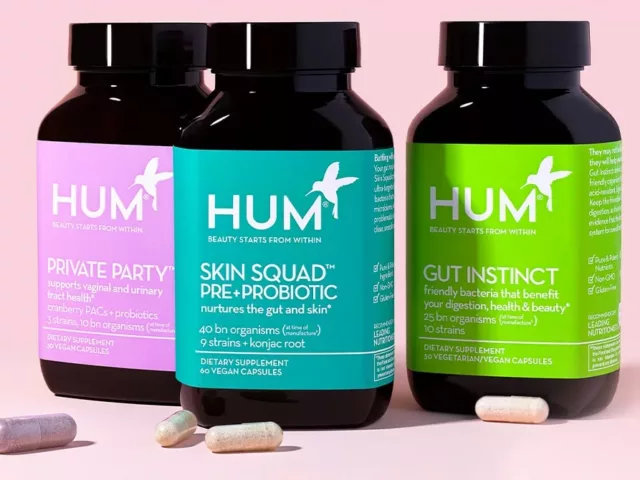 HUM Nutrition probiotics Private Party, Skin Squad, and Gut Instinct on pink background