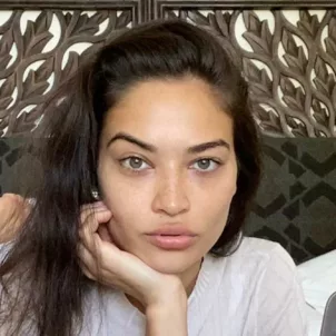 Model Shanina Shaik in bed at home