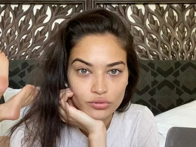 Model Shanina Shaik in bed at home