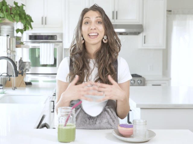 Miriam Jacobson, RD, making a vitamin c smoothie recipe with strawberry, kiwi, kale, and protein powder