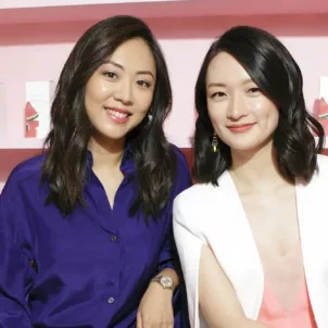 Glow Recipe funders Sarah Lee and Christine Chang in front of pink K-beauty background