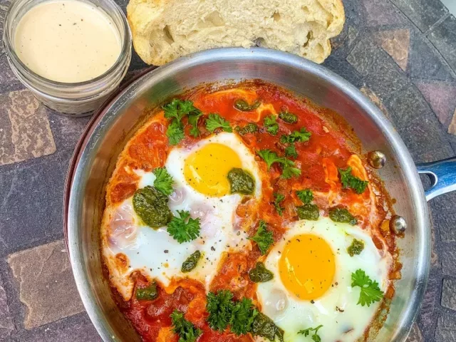 Israeli shakshuka with a traditional shakshuka recipe, with bread and tahini